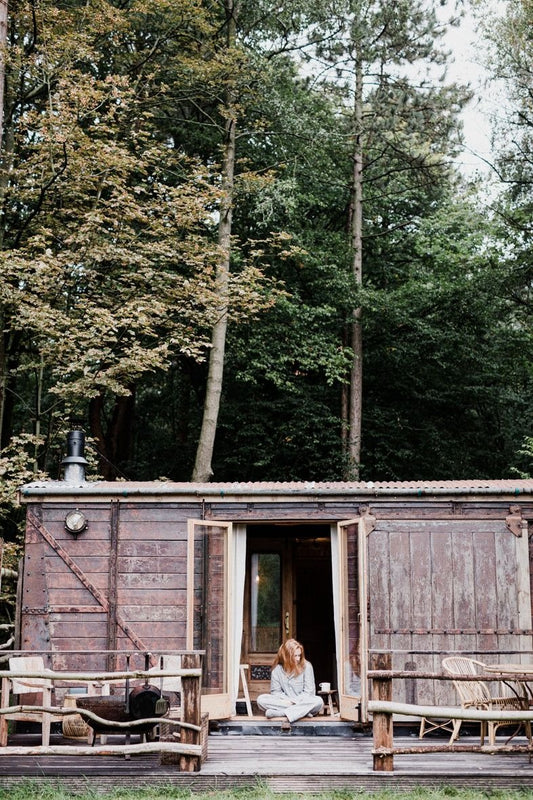 Sitting in front of Settle Norfolk cabin in Piglet pyjamas