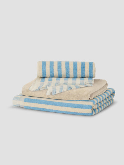 Stack of Coastal Blue Pembroke Stripe and Birch Fringe Edge Towels