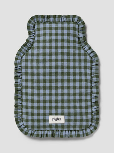 A hot water bottle cover with a green and light blue gingham check pattern and ruffled edges, featuring a white 'piglet' brand label near the bottom, set against a solid light gray background.
