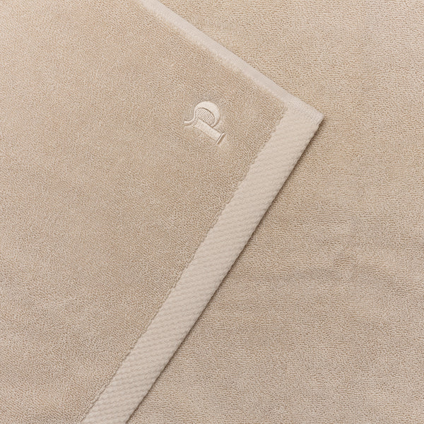 Birch Organic Cotton Bath Mat featuring embroidered logo