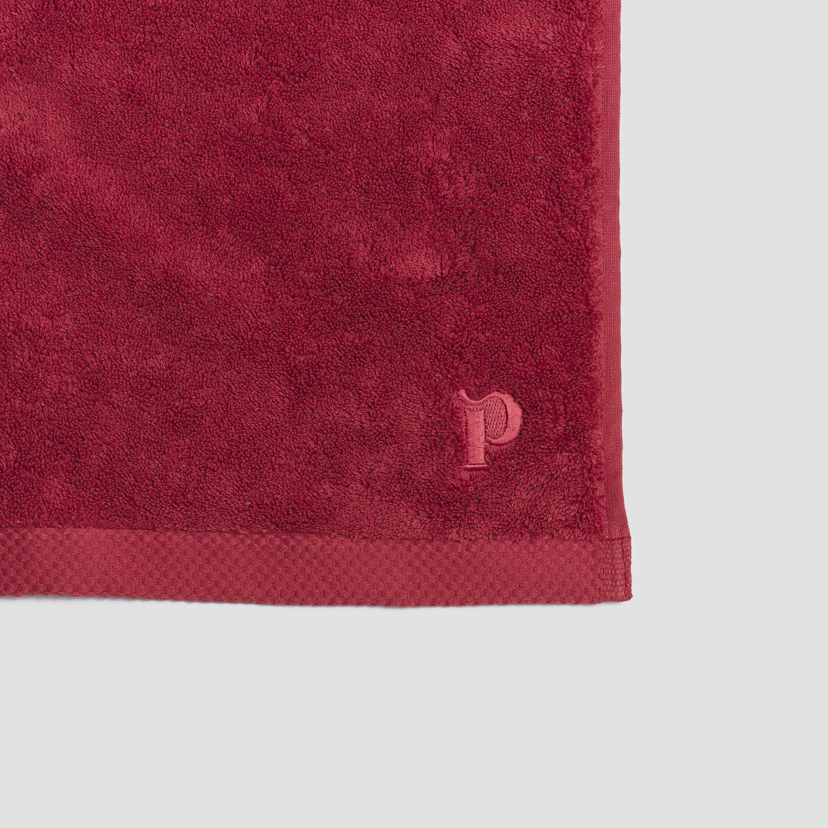 Mineral Red Organic Cotton Towel featuring embroidered logo