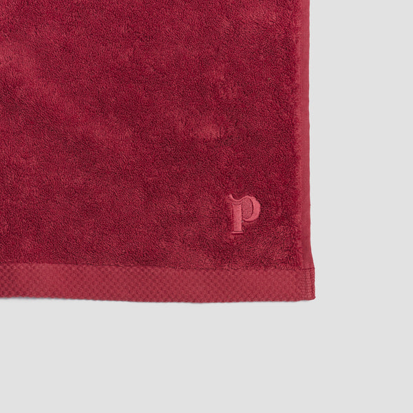 Mineral Red Organic Cotton Towel featuring embroidered logo