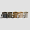 Pottery West Mugs in Nori, Olive, Ochre, Sand, and Powder