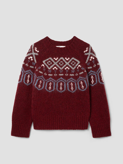 A dark red knit sweater with a traditional Fair Isle pattern in gray, white, and light blue across the chest and shoulders, displayed on a light gray background.