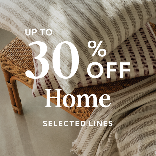 Text overlay on home decor items with 'Up to 30% Off Home Selected Lines' promotion.